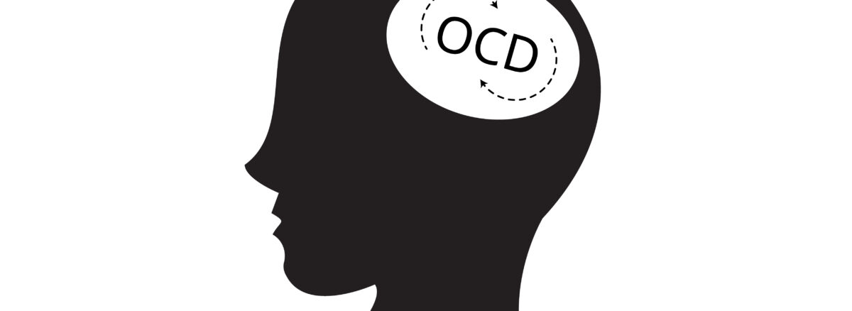 Silhouette of a person with OCD words can be seen inside their brain
